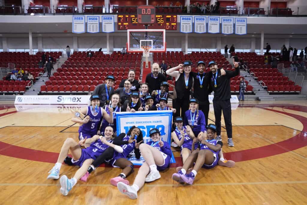 Bishop's Women's Basketball team with RSEQ Banner