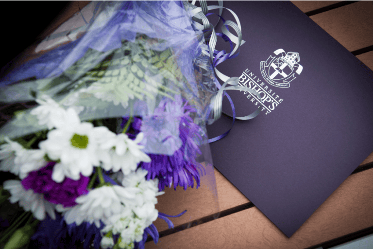A photo of a Bishop's University degree and farm-grown flowers.