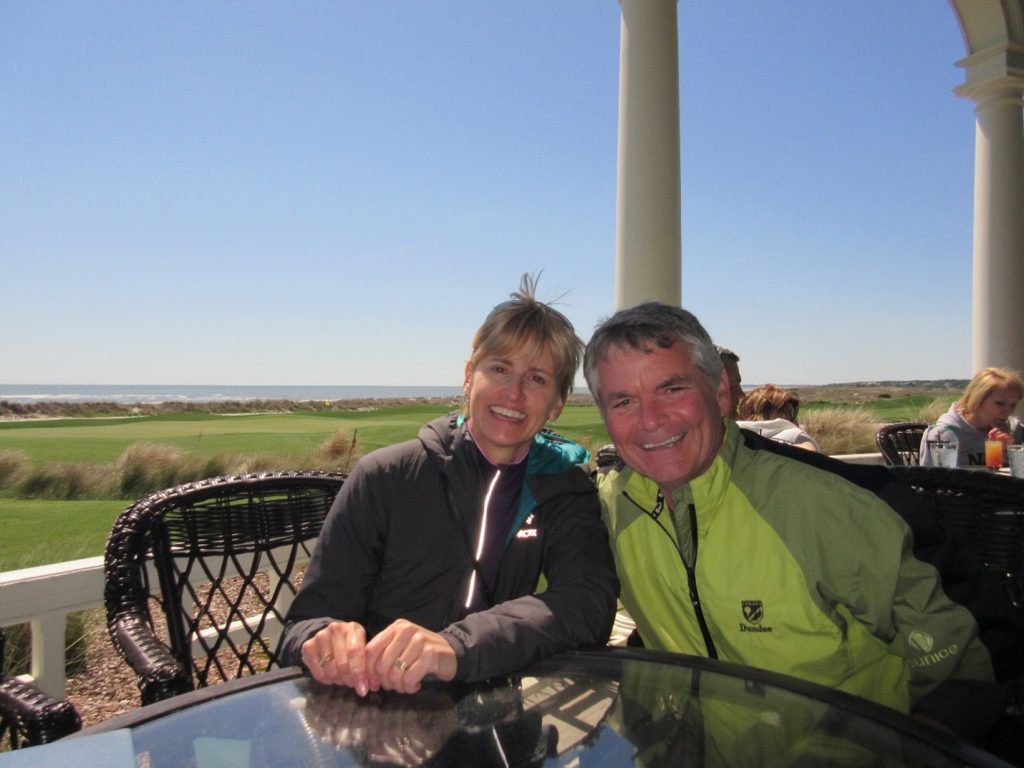 Photo of monthly donors, Bob and Ronna, sitting at a table