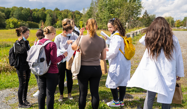 students and professors outside