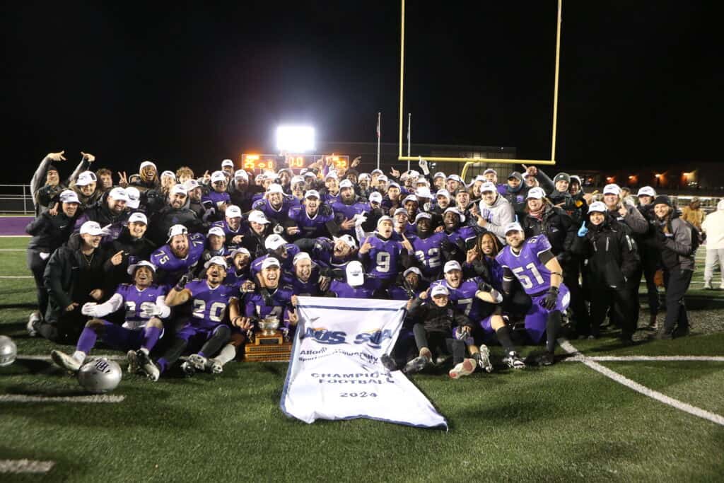 Bishop's Football team with AUS Banner