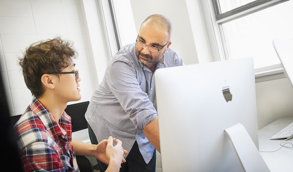 A professor coaching a student