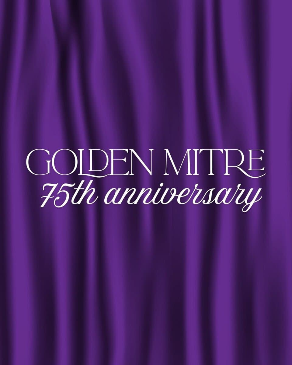 Purple curtain with the words "Golden Mitre 75th anniversary"