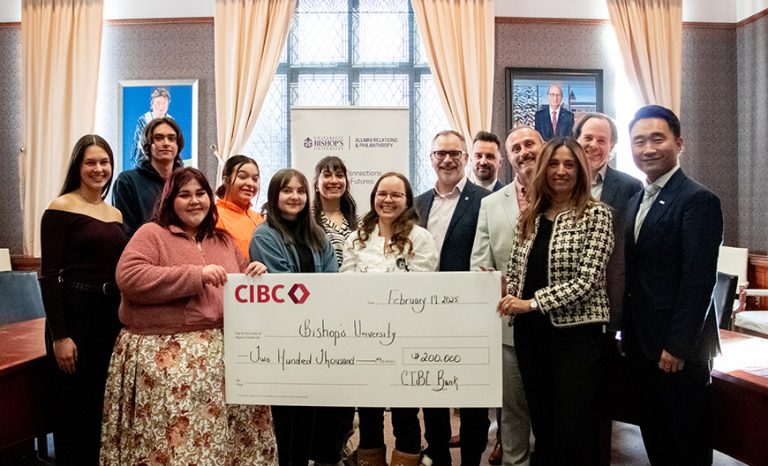 Indigenous students holding the donation cheque from CIBC