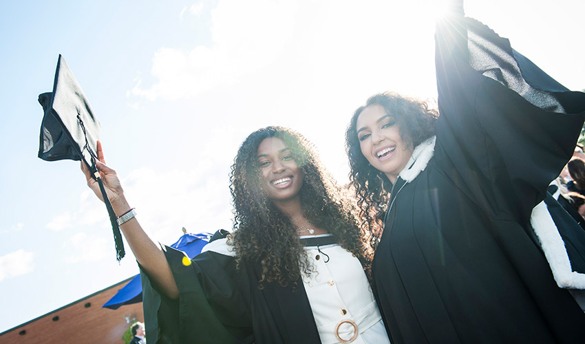 Students celebrating their graduation.