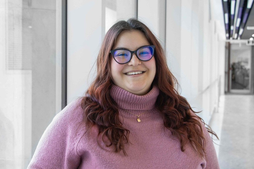 Mihaela Zlatanovska, a woman in a pink turtleneck sweater.