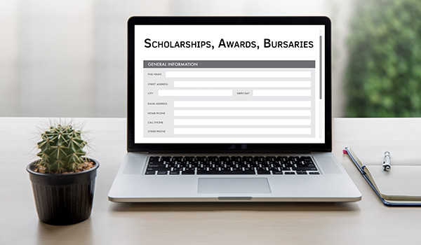 Scholarships, Awards, Bursaries displayed on a laptop