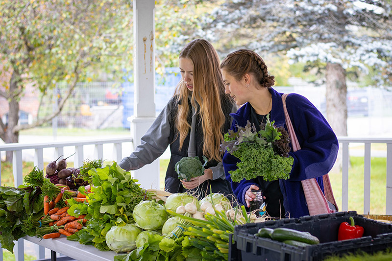 Students selecting their weekly vegetables