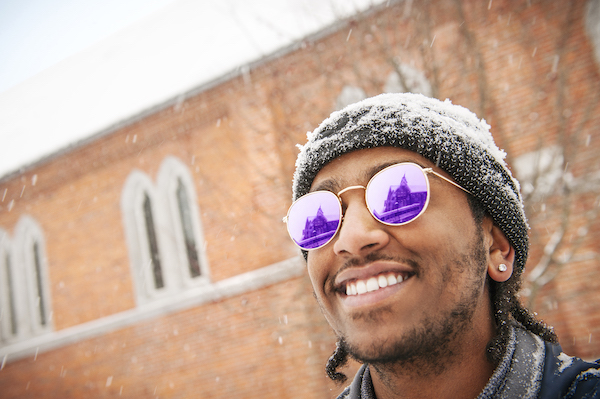 A student outdoors during the winter