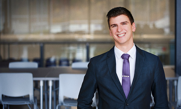 Bishop's student wearing a suit and tie