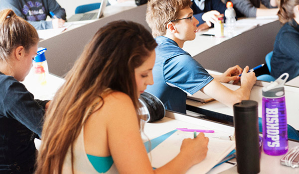 Students writing in class