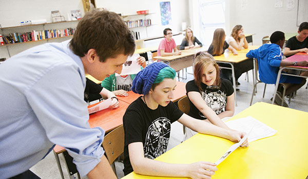 Student doing his internship in a high school class.