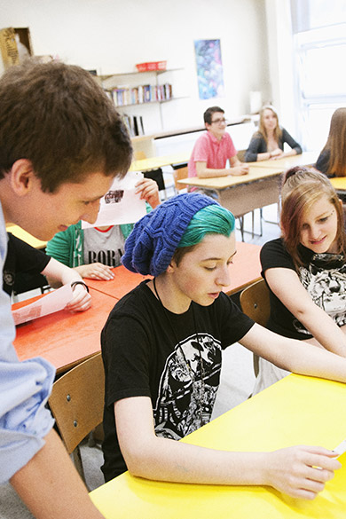 An education student doing his practica in a high school classroom.