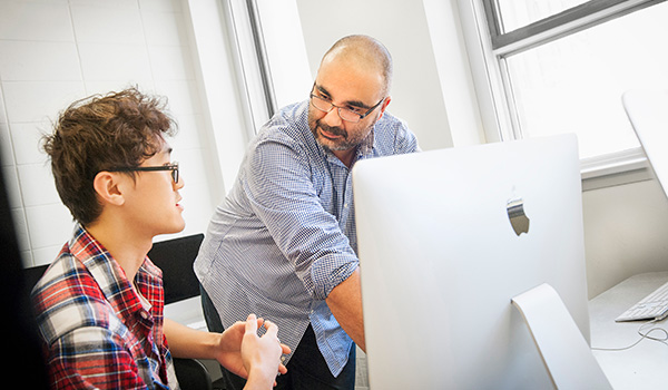 Professor coaching a student