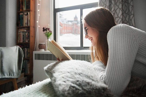 Student reading in her room.