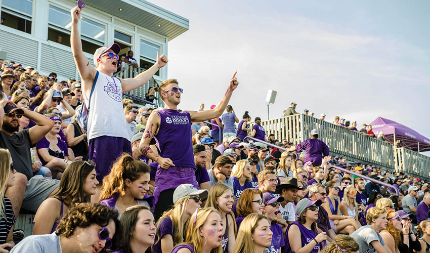 Enthusiastic fans at a sports game.