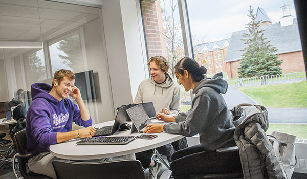 A group of students brainstorming and working together.