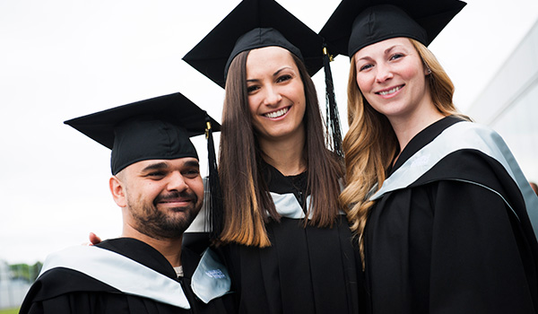 Three students at Convocation