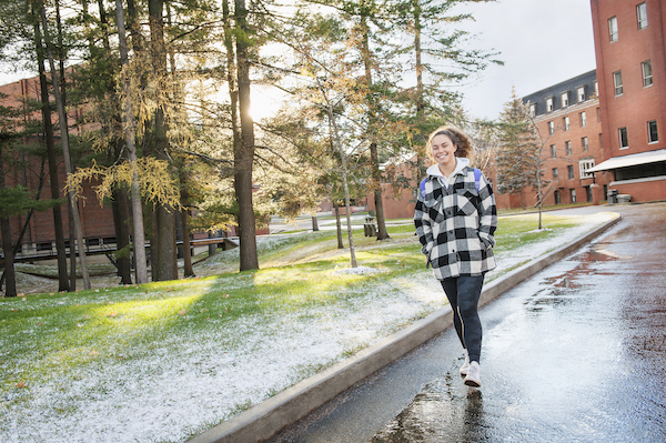 A student walking on our beautiful campus!