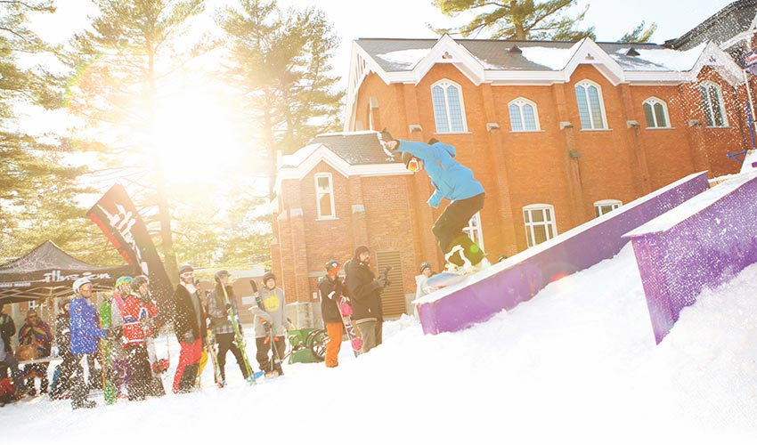 Students snowboarding during winterfest.